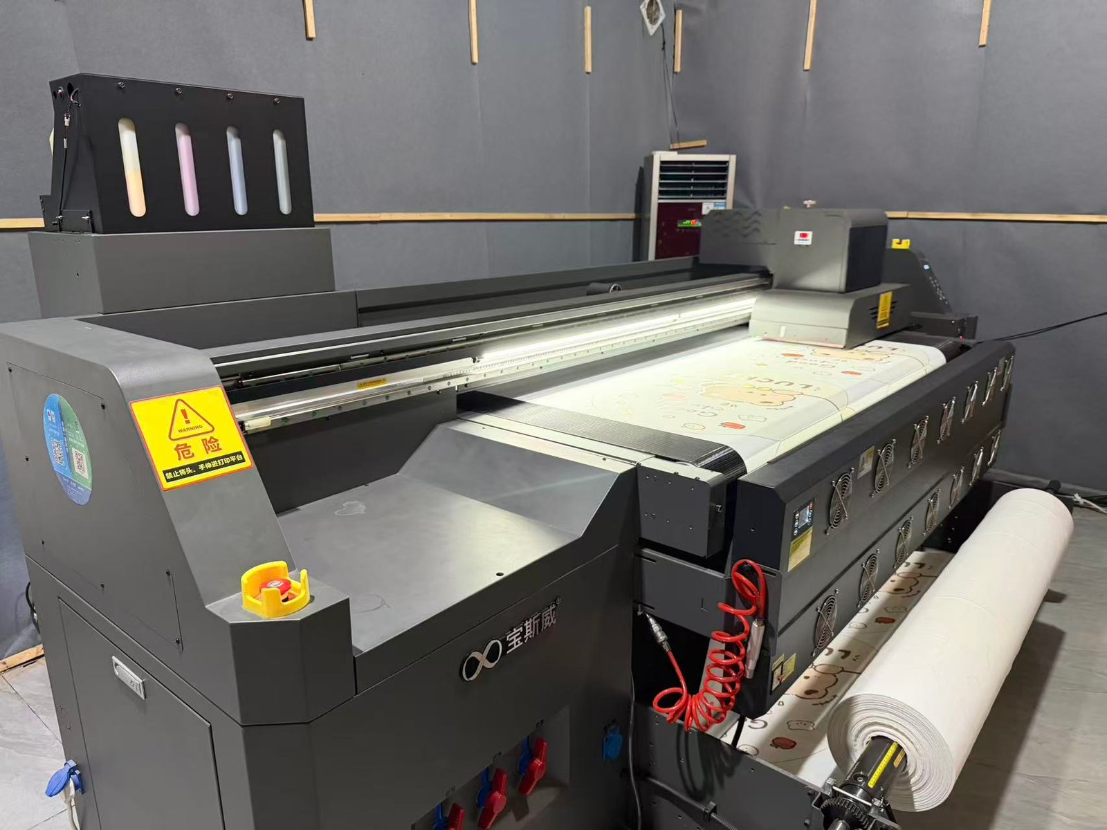 Printing equipment producing custom illustrated material at Jinghong
